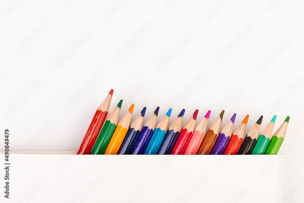 Naklejka premium Many multicolored pencils, isolated on white background with copy space. Art and education background.