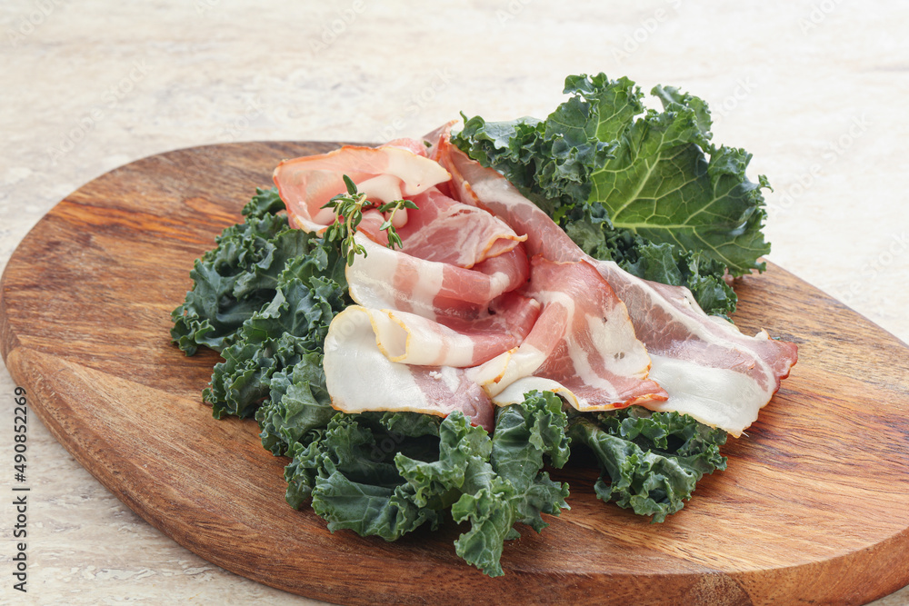 Raw pork bacon over board Raw pork bacon over board