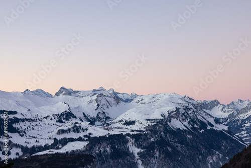 Amazing morning view and an epic sunrise with pink and blue tones. Epic long exposure shot in the heart of Switzerland. Wonderful scenery with the mountain called Grosser Mythen in the background. © Philip
