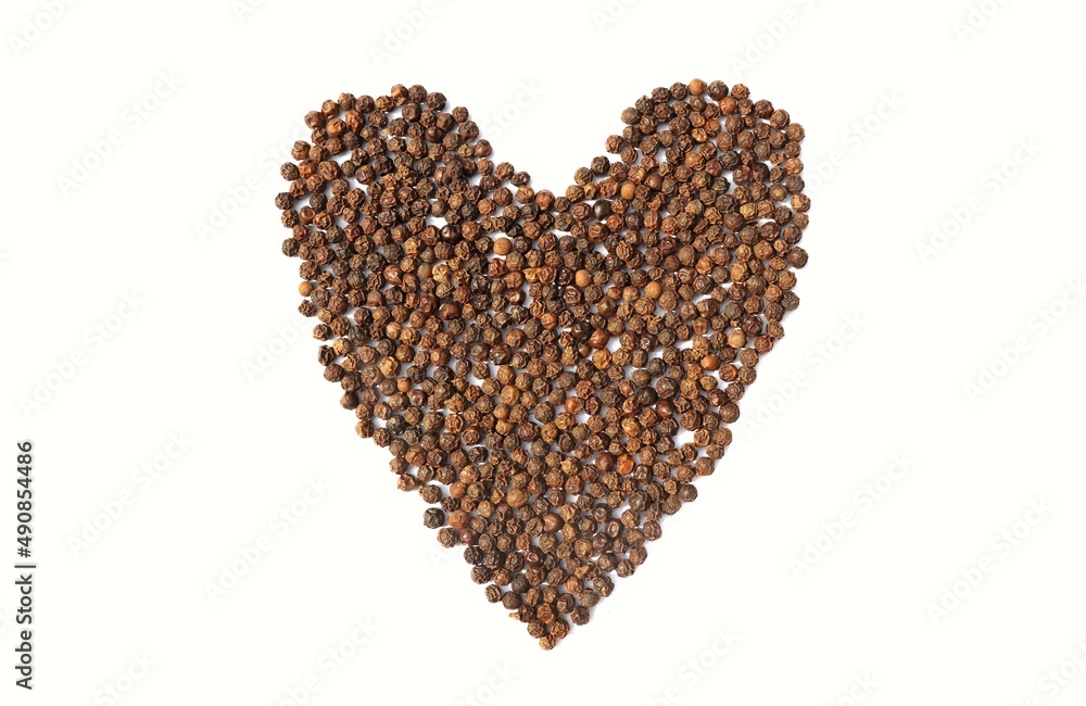 Heart Shape Created with Dry Black Pepper in White Background Heart Shape Created with Dry Black Pepper in White Background