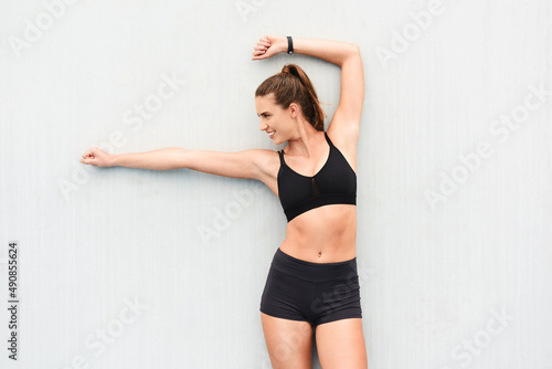 Shes got the right stuff. Cropped shot of an attractive young female athlete posing against a grey background.