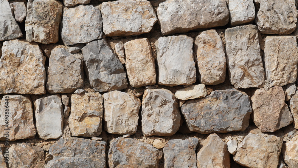 Texture of a stone wall. Old castle stone wall texture background. Stone wall as a background or texture. Part of a stone wall, for background or texture Texture of a stone wall. Old castle stone wall texture background. Stone wall as a background or texture. Part of a stone wall, for background or texture