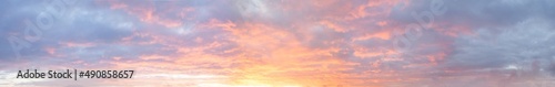 Panoramic bright colorful sunset sky with clouds, nature background © artmim