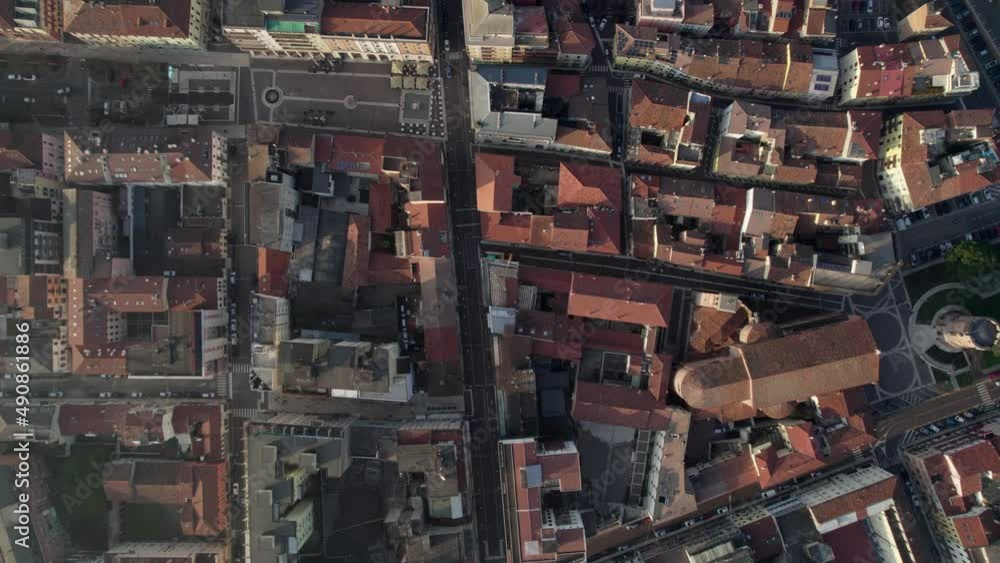 Aerial view of a medieval Italian city on the banks of the Adige River, Veneto region. Roofs with sandrila, river and bridge for the railway. Aerial view of a medieval Italian city on the banks of the Adige River, Veneto region. Roofs with sandrila, river and bridge for the railway.