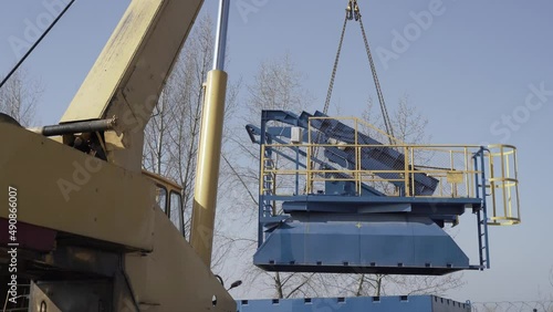 The crane at the plant picked up the equipment