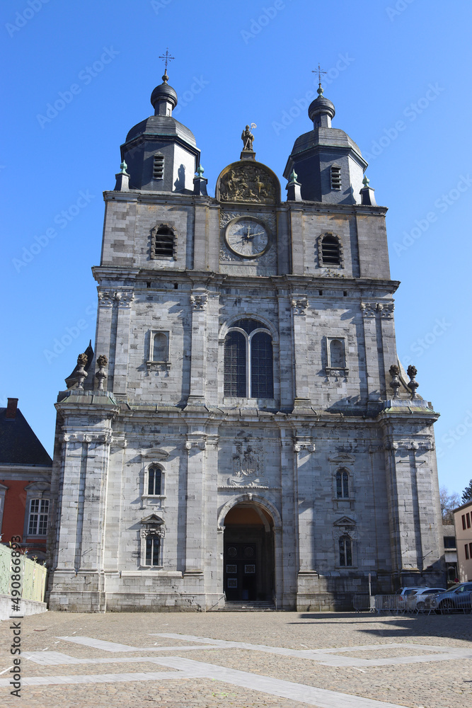 View of the western baroque style facade of the Basilica of St. Hubert in the town of St. Hubert in the province of Luxembourg in the Belgian Ardennes. View of the western baroque style facade of the Basilica of St. Hubert in the town of St. Hubert in the province of Luxembourg in the Belgian Ardennes.