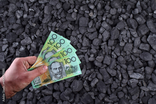  Australian currency showed on coal of mine deposit mineral resources background