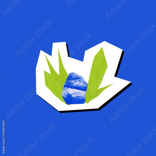 egg in grass collage sticker. illustration in cut out paper technique 