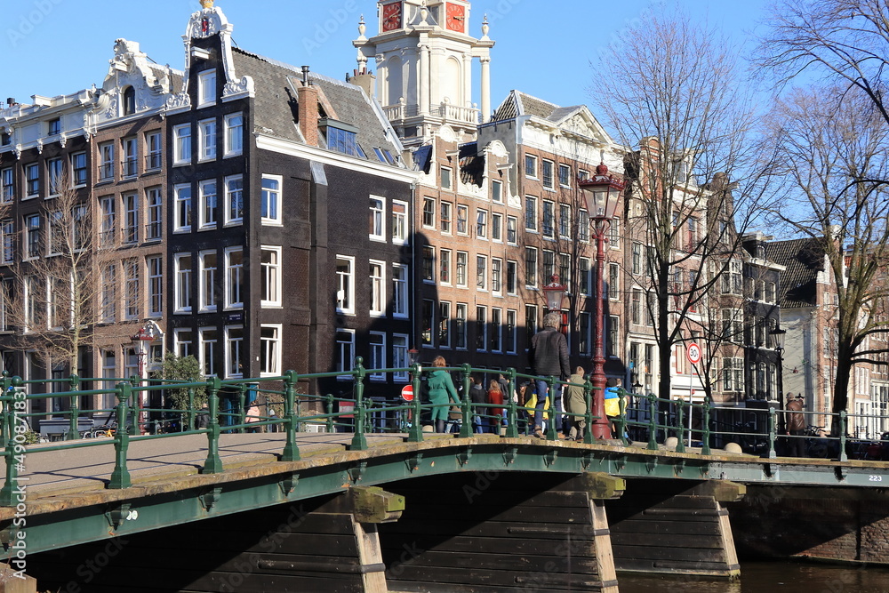 Amsterdam Kloveniersburgwal Canal  Street View with Bridge and Historic House Facades, Netherlands
