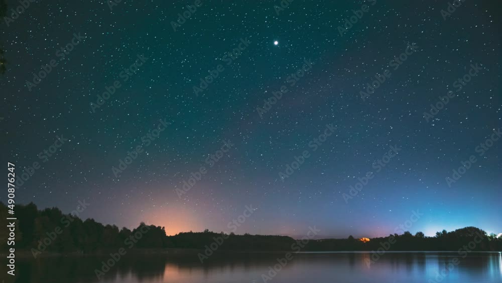Lyepyel District, Vitebsk Province, Belarus. Real Colorful Night Stars Above Lepel Lake. Natural Starry Sky Background Backdrop Landscape. Time lapse. 4K.