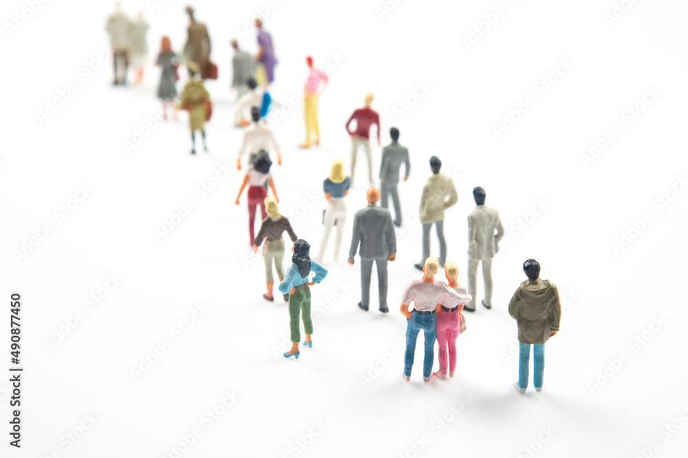 miniature people. different people communicate with each other on a white background miniature people. different people communicate with each other on a white background