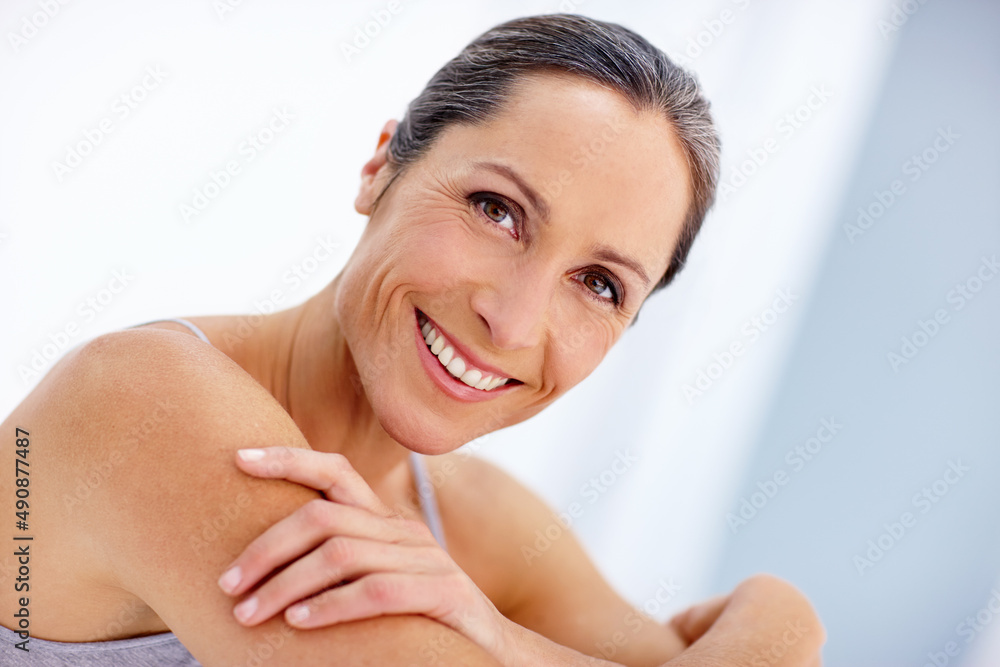 Facing age with a carefree attitude. Cropped portrait of a beautiful mature woman posing in studio. Facing age with a carefree attitude. Cropped portrait of a beautiful mature woman posing in studio.