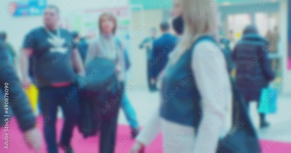 time lapse. modern business life. defocused blurry video. background on the theme of business. blurred silhouettes of unrecognizable people walking in a large hall. time lapse. modern business life. defocused blurry video. background on the theme of business. blurred silhouettes of unrecognizable people walking in a large hall.