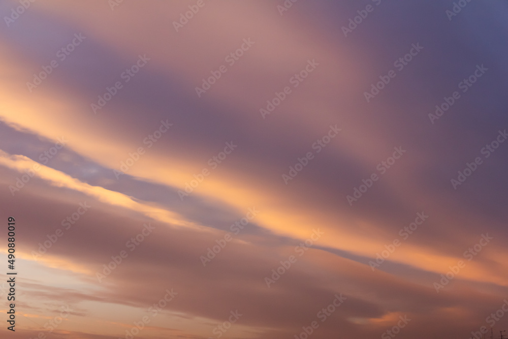 Sunset sky background. Fantastic colorful sunrise with cloudy sky.