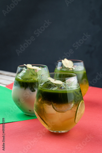 Modern matcha lemonade close up art photography with flowers and bright background