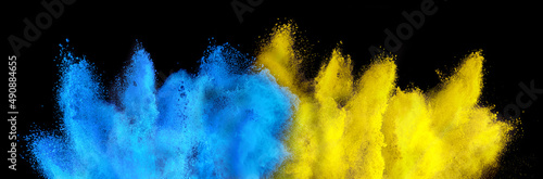 Obraz na plátně colorful ukrainan flag yellow blue color holi paint powder explosion isolated black background