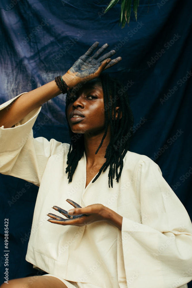 Portrait of a young african indigo eco fashion designer - obrazy, fototapety, plakaty 