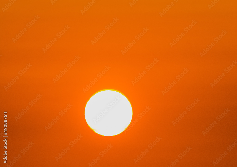  Sun in orange sky background