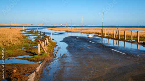 Lindisfarne Causeway is submerged at high tide, as part of the coastal section on the Northumberland 250, a scenic road trip though Northumberland with many places of interest along the route photo