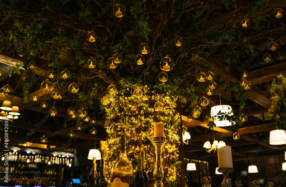 Decoration lights in the restaurant. Decoration for a room. Golden tree 