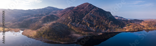 Aerial drone panorama of Llyn Cwm Bychan - a mountain lake in north Wales part of the Rhinogydd mountains in the Snowdonia National Park