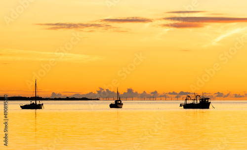 Fishing boats on the River Dee estuary at Thurstaston on the Wirral shot at sunset
