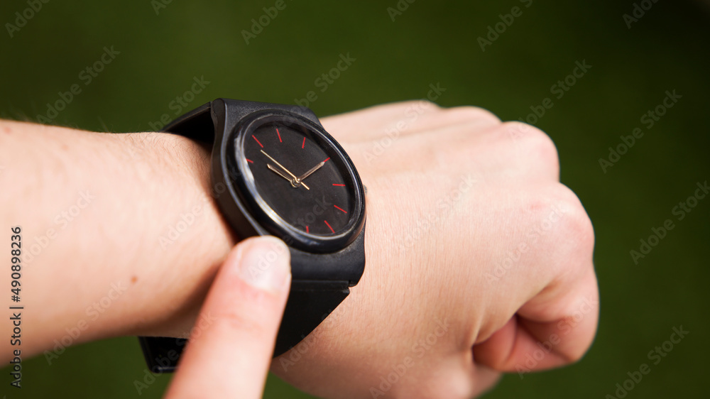 Fototapeta premium checking time pointing finger