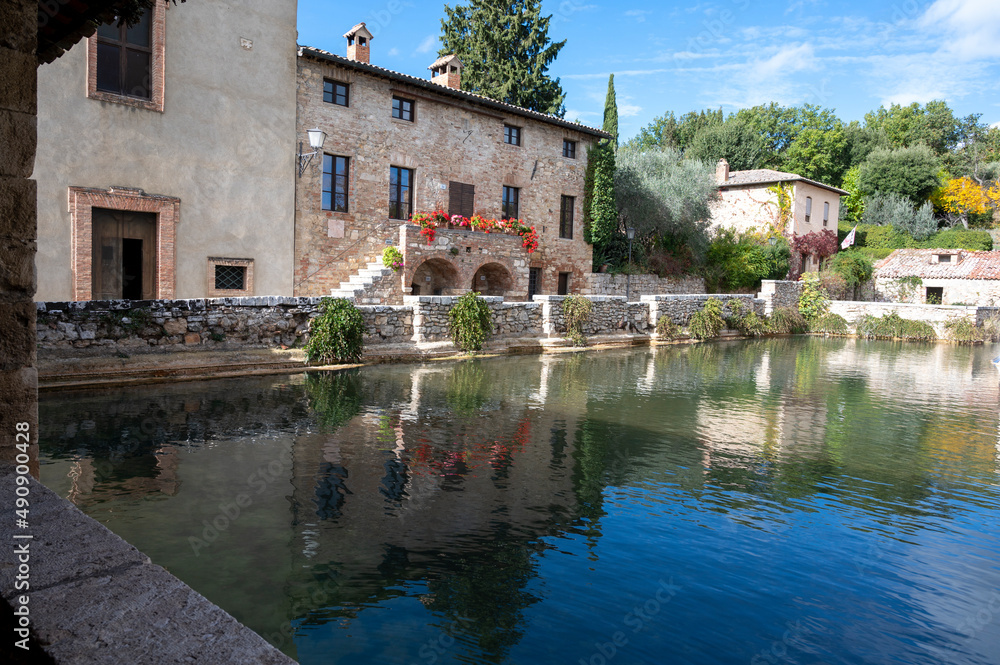 Ancient natural hot springs pool in small Italian village Bagno Vignoni in Tuscany