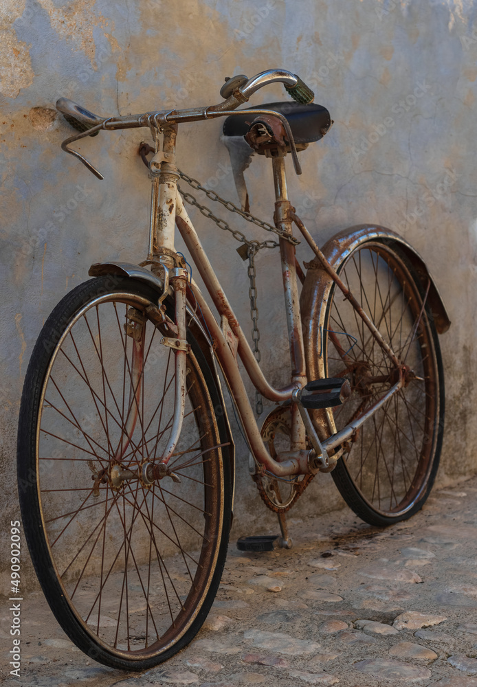 Old bicycle perched on a street in a town