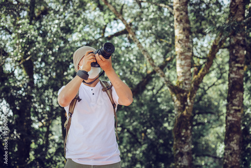 Professional male photographer wearing mask during shooting camera outdoor portraits © AungMyo