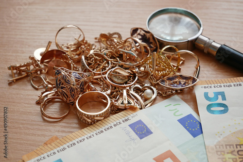 many golden and silver jewerly and money, pawnshop concept, jewerly shop concept