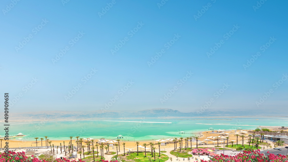 Ein Bokek, Israel - Dead Sea beach hotel resort shore.