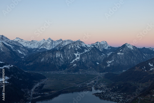 What a wonderful sunrise in the Swiss Alps  in the canton of Glarus to be exact. The sky turns red and pink over the mountain peaks.