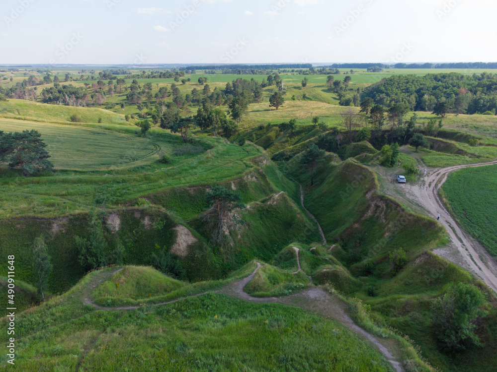 Kyiv region, Ukraine. Deep ravine seen from above. Aerial drone view. Kyiv region, Ukraine. Deep ravine seen from above. Aerial drone view.