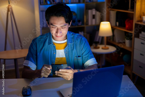 Canvas Print man using phone at home
