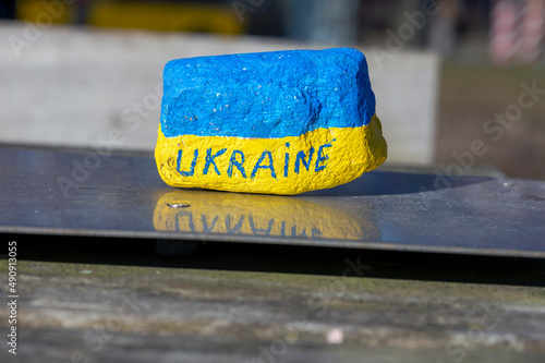 Stone with the same colors as the Ukrainian flag and with Ukraine written on it