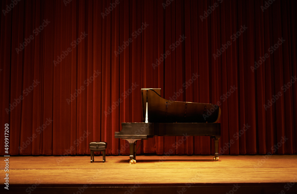 Fototapeta premium Ready for the show. Shot of a piano on a stage.