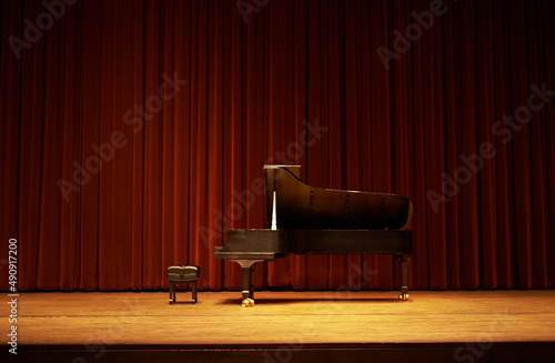 Photos Ready for the show. Shot of a piano on a stage.