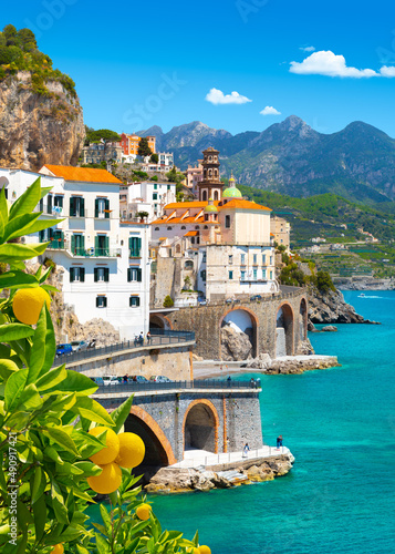 Beautiful view of Amalfi on the Mediterranean coast with lemons in the foreground, Italy