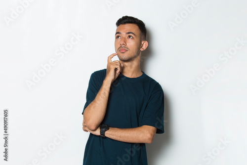young handsome man thinking isolated on white background
