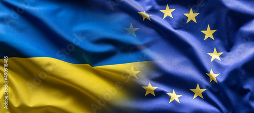 Ukrainian and the EU flag blending into each other as European Union leans towards the membership of Ukraine