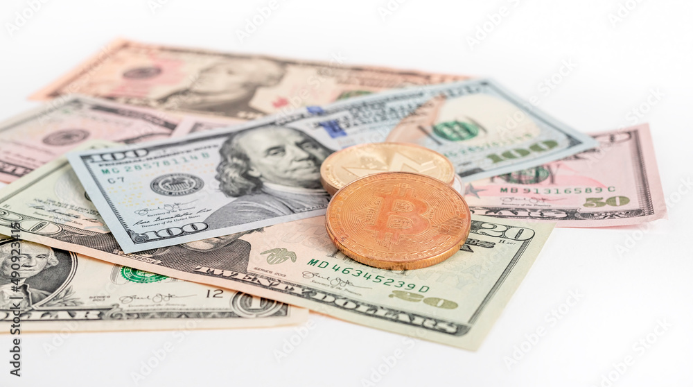 Bitcoin coins at dollar bills pile. Cryptocurrency and cash money concept. High quality photo Bitcoin coins at dollar bills pile. Cryptocurrency and cash money concept. High quality photo