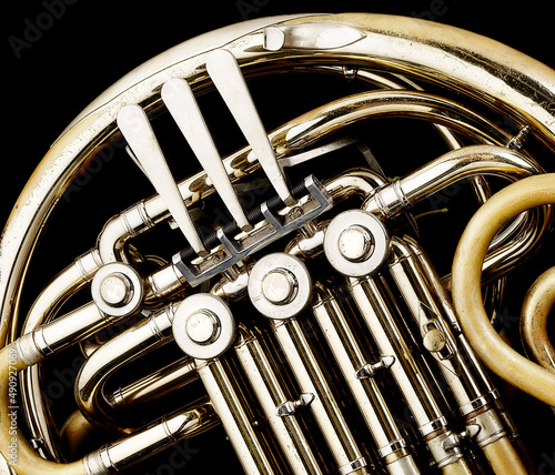 The worn out details of a much loved and played French Horn.