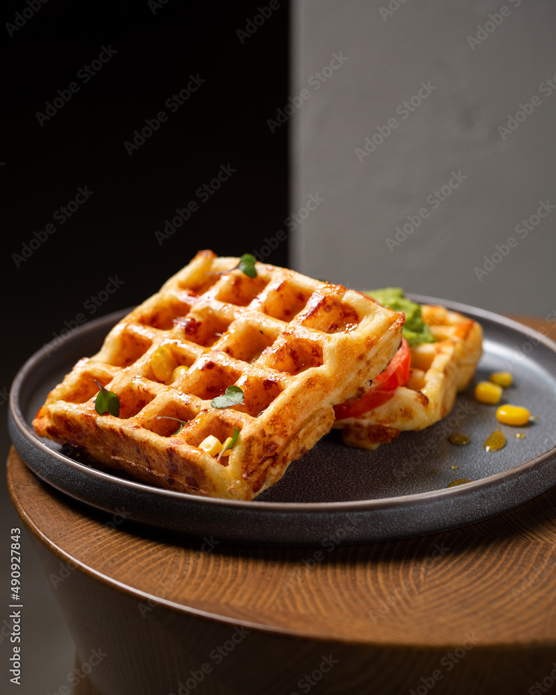 Belgian cheese waffles with guacamole, tomato and syrup Belgian cheese waffles with guacamole, tomato and syrup
