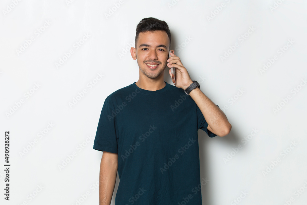 happy young man using mobile phone isolated on white background
happy young man using mobile phone isolated on white background