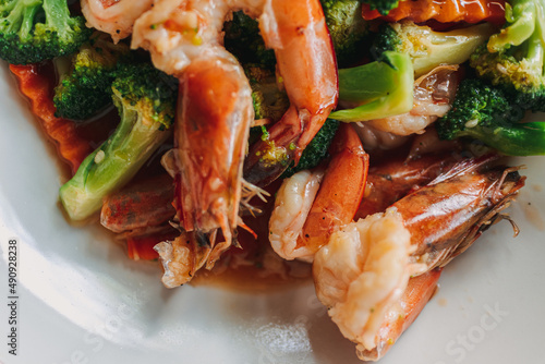 Fototapeta Naklejka Na Ścianę i Meble -  Close up of Thai food Stir Fried Broccoli with Shrimp on white dish.