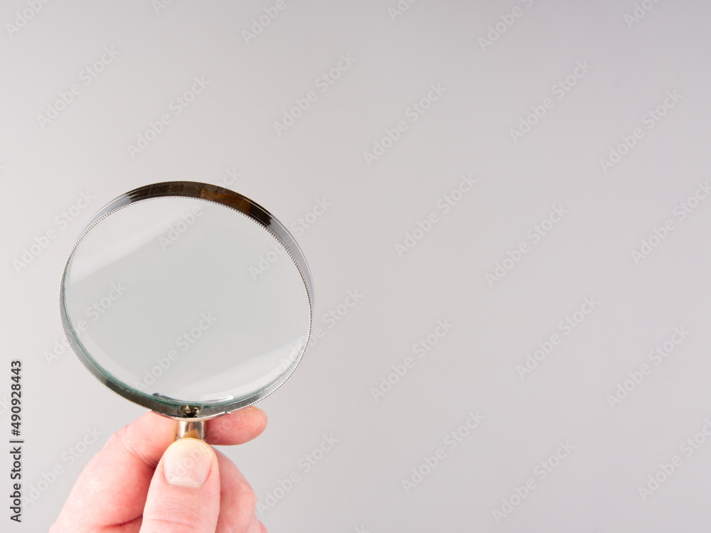 Magnifying glass on a gray background. Magnifying glass on a gray background.
