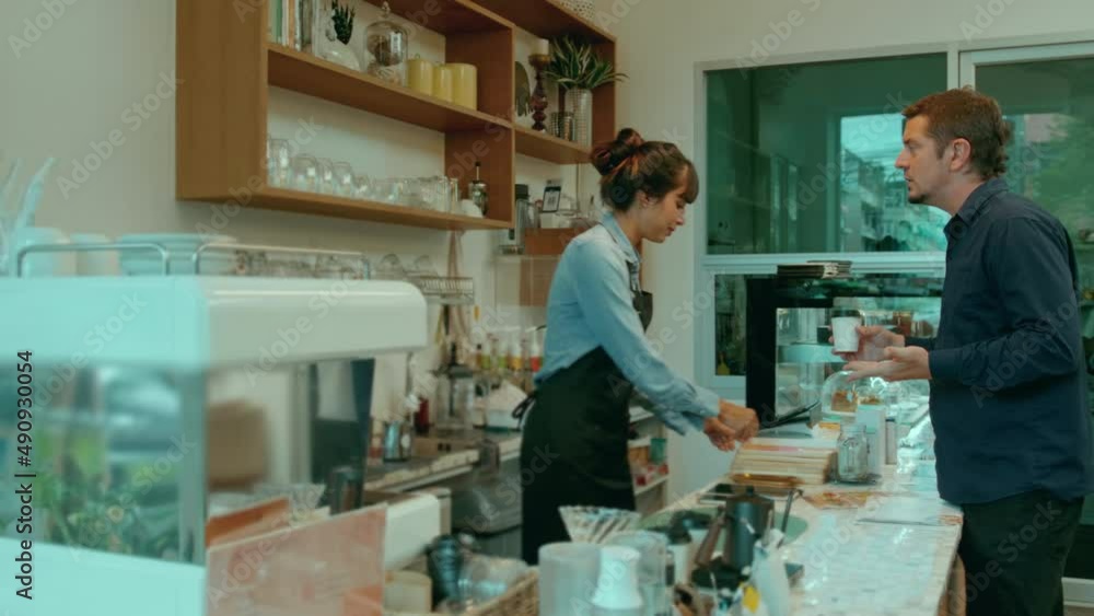 Angry customer complaining about barista in coffee shop Angry customer complaining about barista in coffee shop
