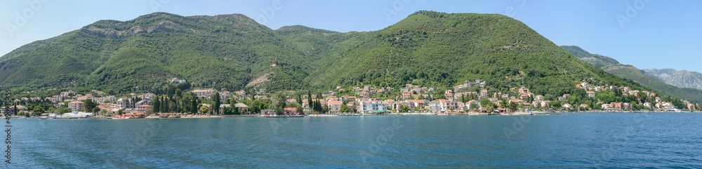 View towards Bijela and Baošići from water of bay, Montenegro.