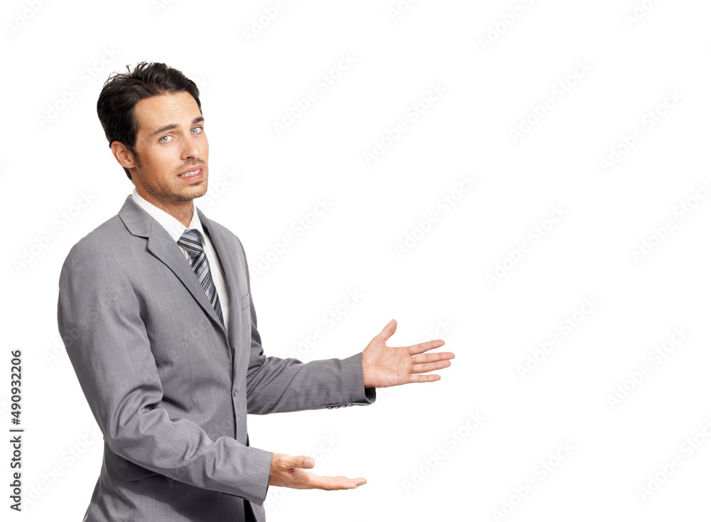 Please look at this. A nervous young businessman gesturing towards copyspace while isolated on a white background. Please look at this. A nervous young businessman gesturing towards copyspace while isolated on a white background.